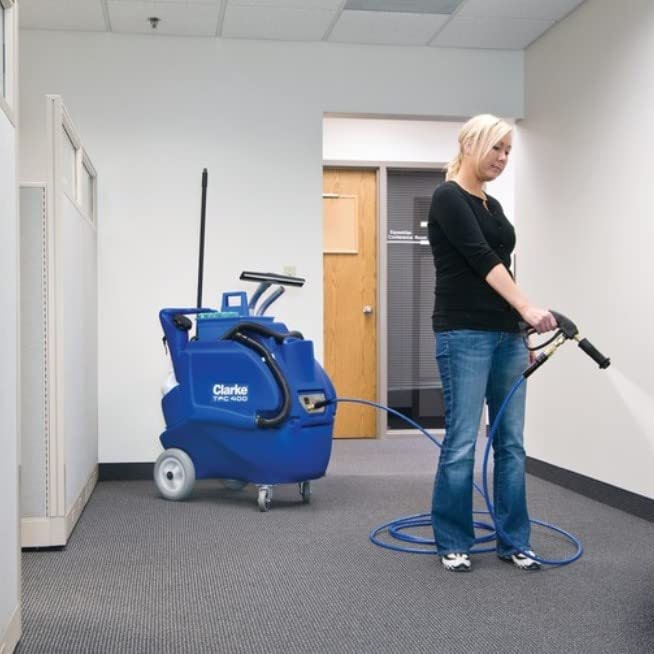 Woman using the Clarke TFC 400 sprayer device