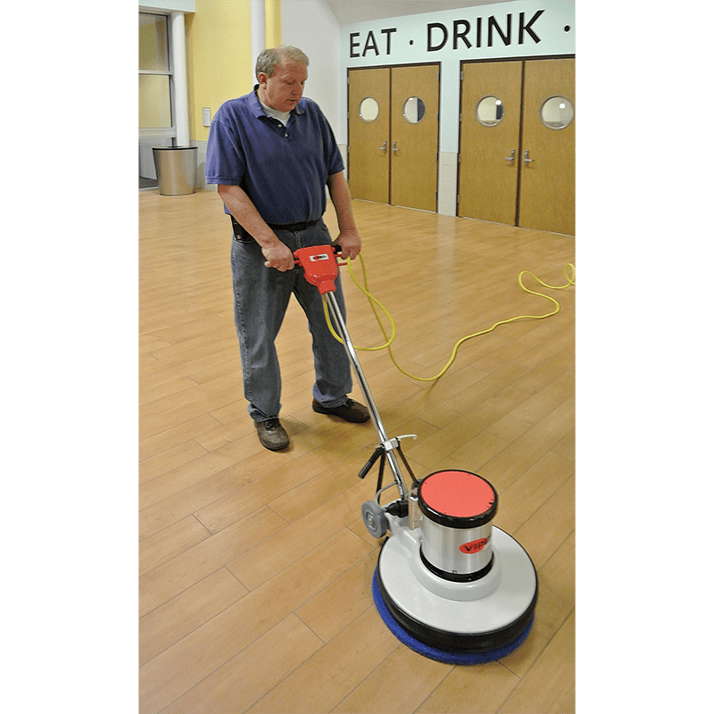 Operator uses a Viper Venom Floor Buffer  on a gym floor