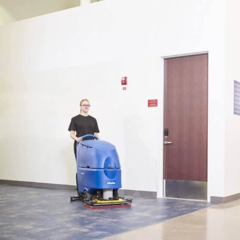 Professional-grade Clarke CA60 20DT 20" AGM Cordless Walk Behind Disc Floor Scrubber with Traction Drive - 16 Gallon: Efficient floor cleaning equipment.