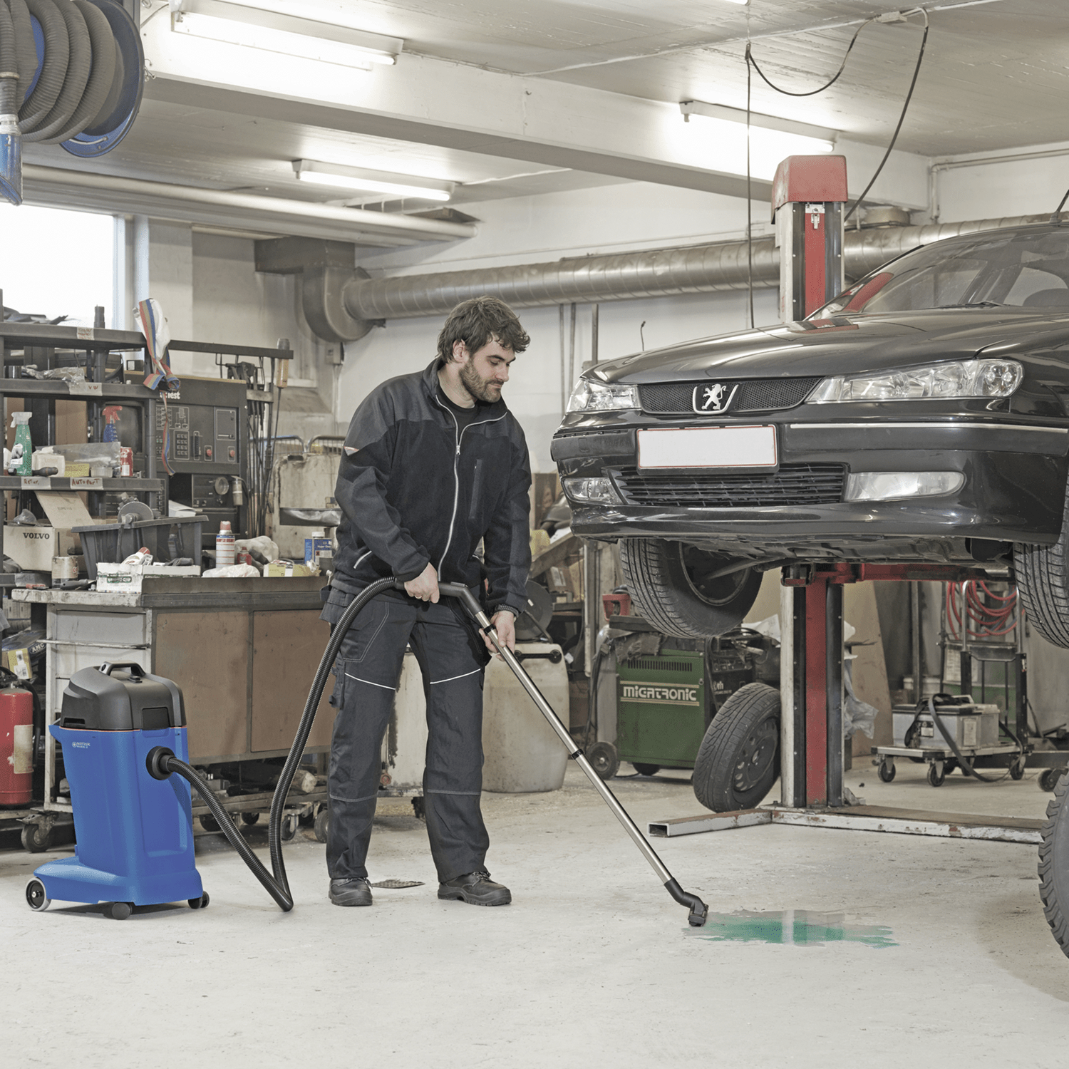 Cleaning up a spill in an auto body shop with the Clarke Maxxi Wet Dry Vacuum