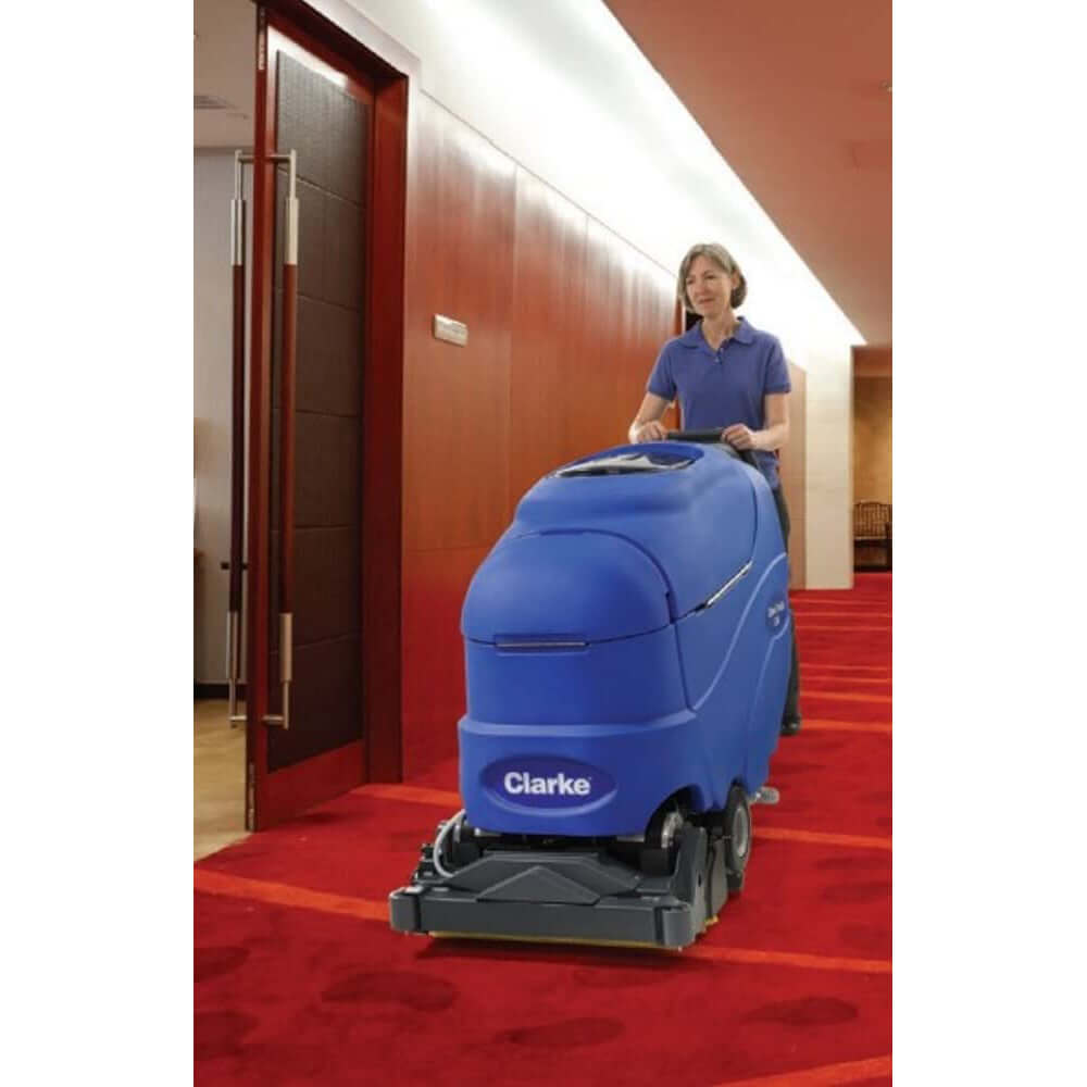 Operator with a Clarke CleanTrack L24 Carpet Extractor in a hotel 